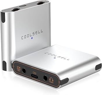 Kompaktes silbernes Audio-Interface mit Anschlüssen und Bedienelementen